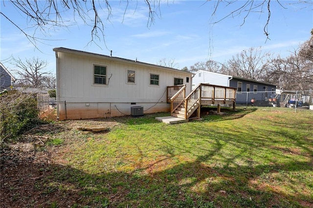 rear view of property with a wooden deck, a yard, a fenced backyard, crawl space, and central air condition unit