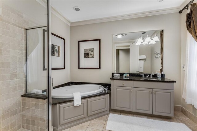 bathroom featuring tiled shower, ornamental molding, a garden tub, tile patterned flooring, and vanity