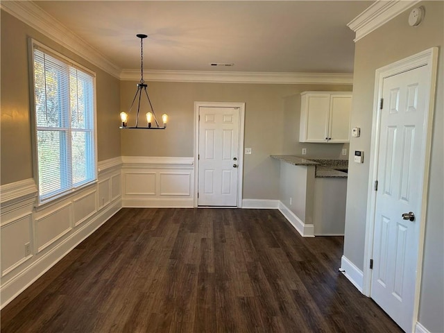 unfurnished dining area featuring a notable chandelier, dark hardwood / wood-style flooring, and crown molding