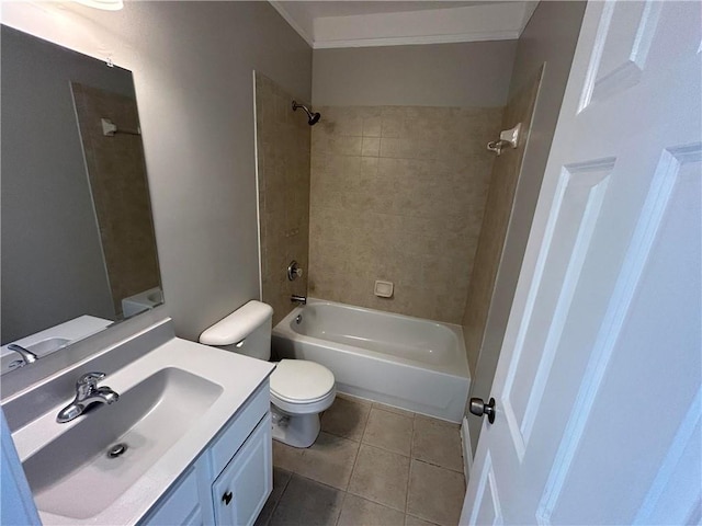 full bathroom with vanity, tile patterned floors, tiled shower / bath combo, toilet, and ornamental molding