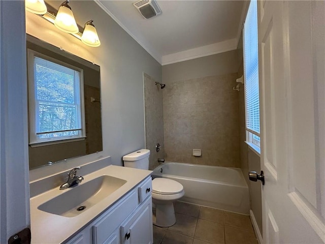 full bathroom featuring tiled shower / bath combo, tile patterned floors, crown molding, toilet, and vanity