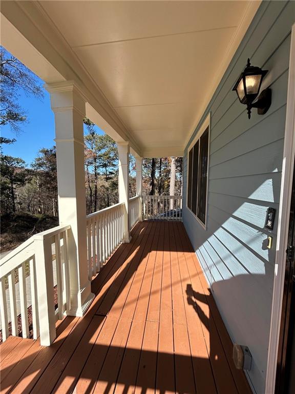 wooden terrace featuring covered porch