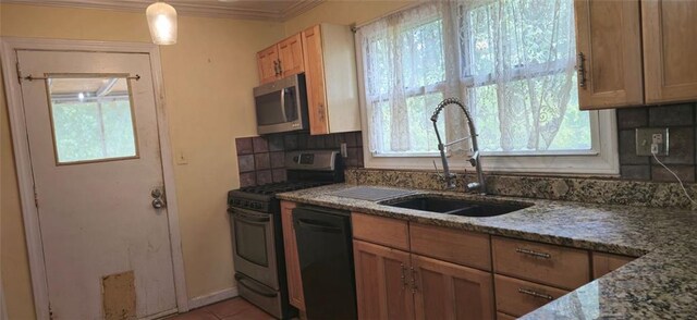 kitchen featuring tasteful backsplash, stone countertops, sink, crown molding, and stainless steel appliances