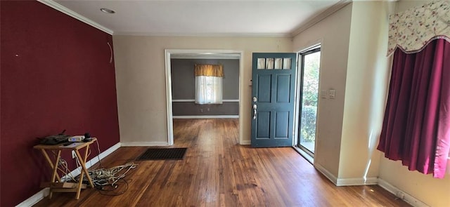 foyer entrance featuring hardwood / wood-style flooring, crown molding, and a healthy amount of sunlight