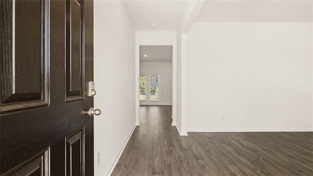 corridor with dark wood-type flooring