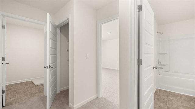 bathroom with bathing tub / shower combination