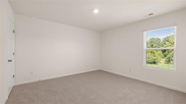 unfurnished room with carpet floors