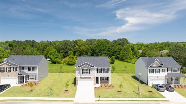 view of front facade featuring a garage and a front yard