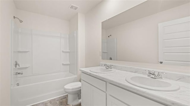 full bathroom featuring vanity, shower / tub combination, and toilet