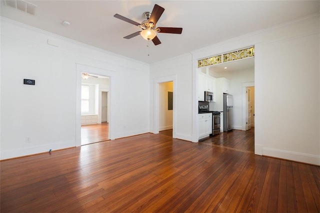 unfurnished living room featuring visible vents, crown molding, baseboards, ceiling fan, and dark wood-style floors