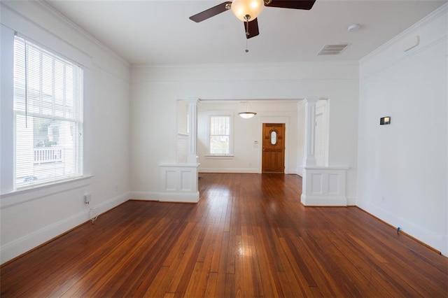 unfurnished room with plenty of natural light, visible vents, dark wood-style flooring, and ceiling fan