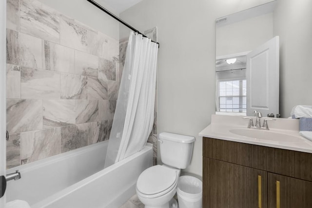 full bathroom with vanity, toilet, and shower / bath combo