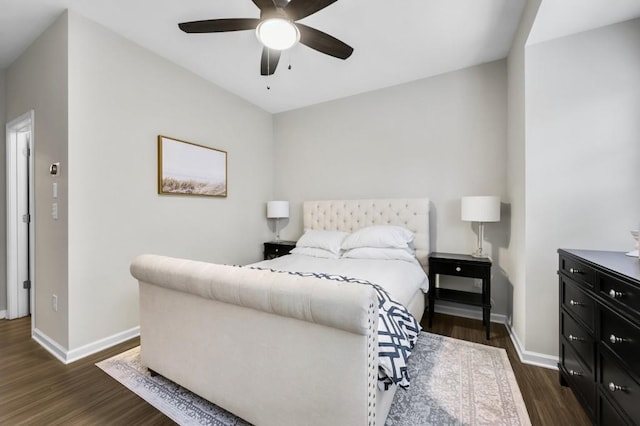 bedroom featuring dark hardwood / wood-style flooring and ceiling fan