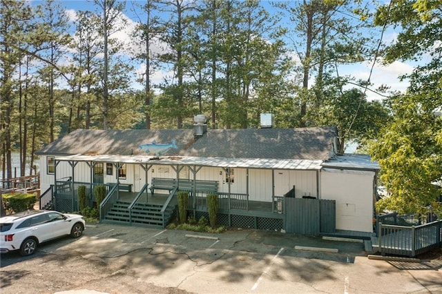 view of building exterior with uncovered parking