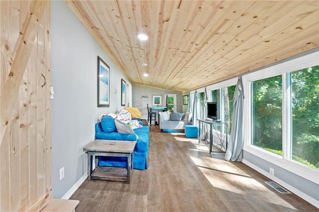 sunroom with wood ceiling, wood finished floors, plenty of natural light, baseboards, and recessed lighting