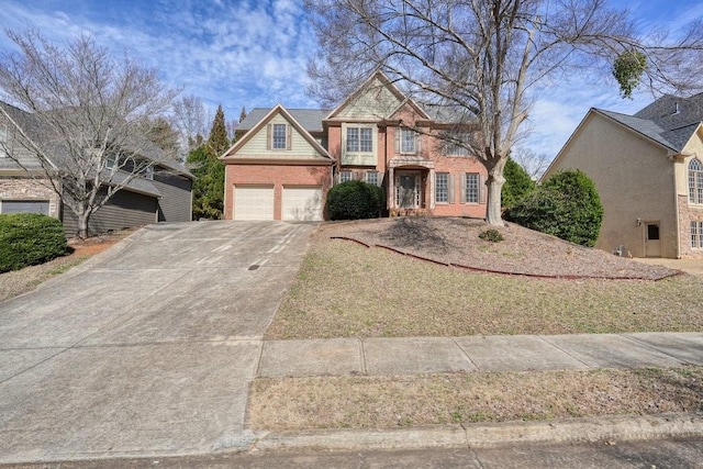 view of front of property with brick siding, a garage, and concrete driveway