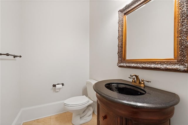 bathroom with vanity, tile patterned floors, and toilet