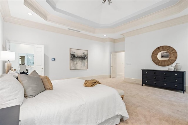 bedroom featuring ceiling fan, a raised ceiling, carpet floors, and ornamental molding