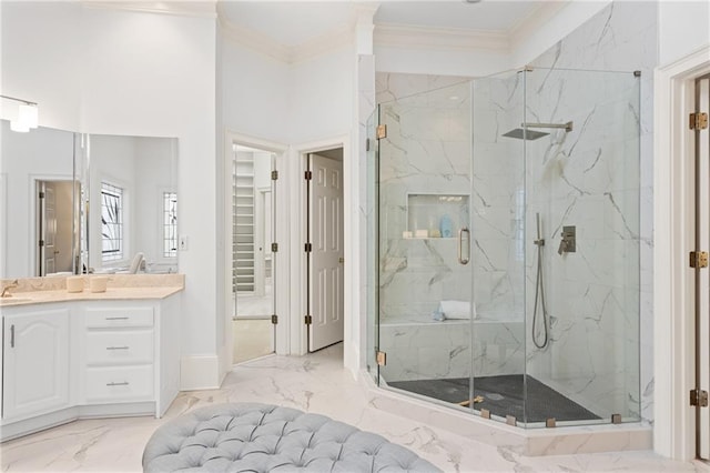 bathroom featuring vanity, crown molding, and a shower with door