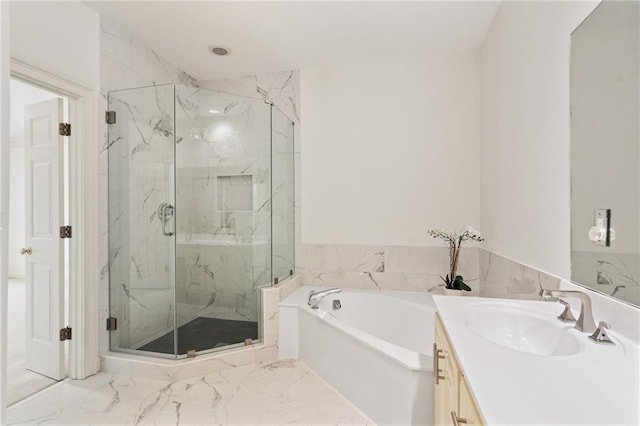 bathroom with shower with separate bathtub and vanity