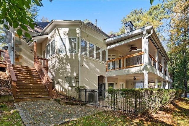 rear view of house with ceiling fan