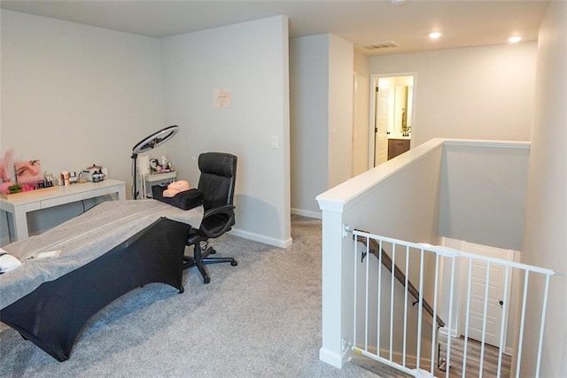 interior space with recessed lighting, baseboards, visible vents, and light colored carpet