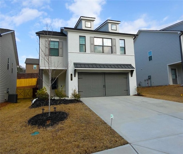 view of front of home with driveway, metal roof, an attached garage, a standing seam roof, and central AC