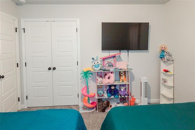 bedroom with carpet floors and a closet