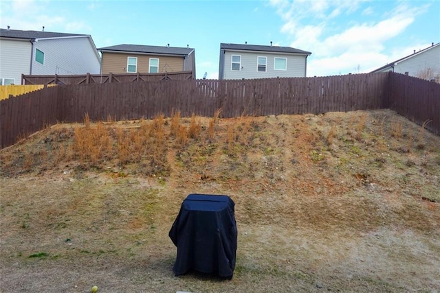 view of yard with a fenced backyard