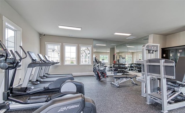 workout area featuring baseboards