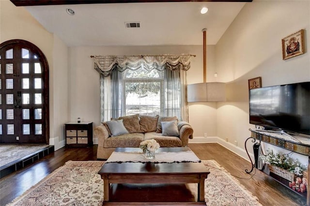 living area with lofted ceiling, recessed lighting, visible vents, baseboards, and dark wood finished floors