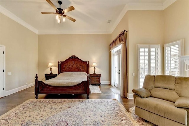 bedroom featuring dark wood-type flooring, crown molding, baseboards, and ceiling fan