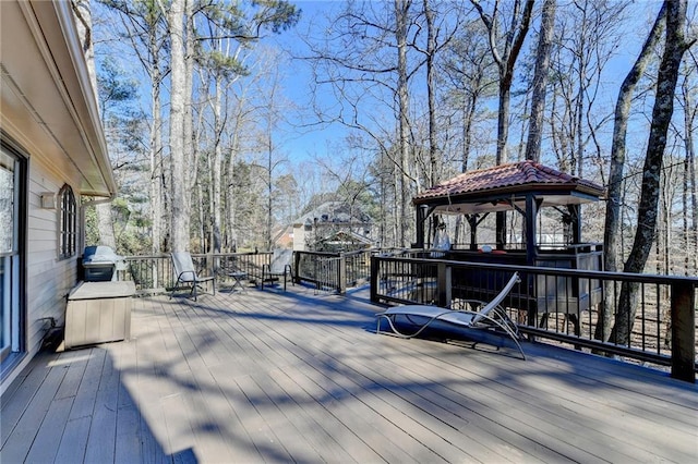 deck featuring a grill and a gazebo