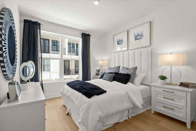 bedroom featuring light wood-style flooring