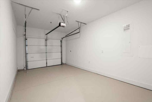 garage featuring baseboards and a garage door opener