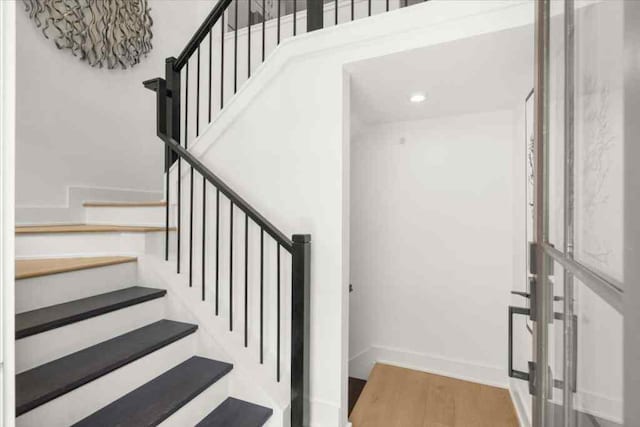 stairway featuring hardwood / wood-style flooring