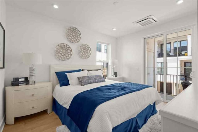 bedroom featuring visible vents, access to outside, light wood-style floors, and recessed lighting