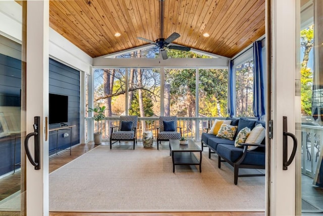 sunroom with ceiling fan, lofted ceiling, and wooden ceiling