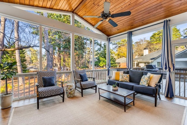 sunroom with wood ceiling, ceiling fan, and vaulted ceiling