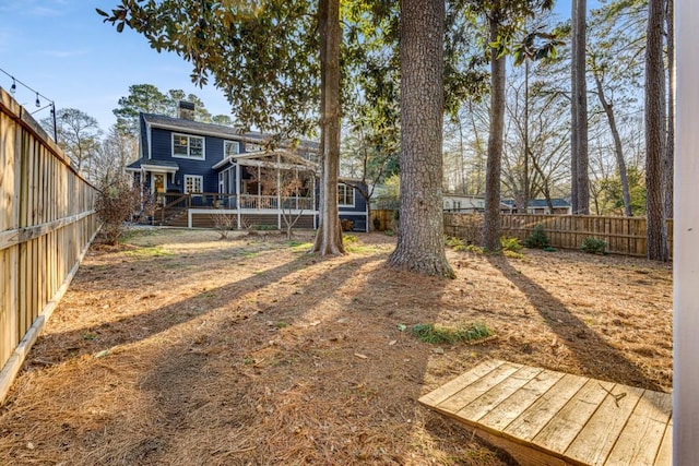 view of yard with a wooden deck