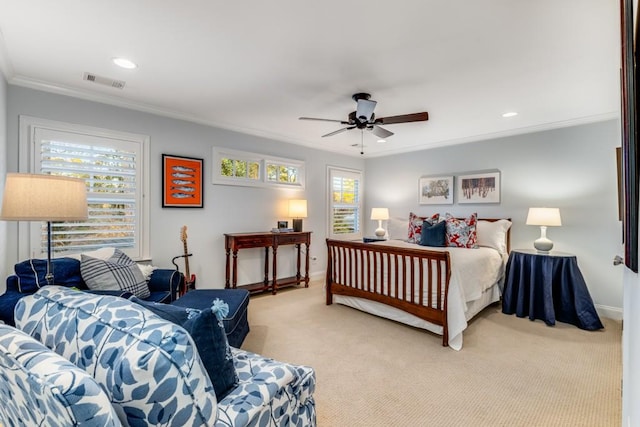 carpeted bedroom featuring ornamental molding and ceiling fan