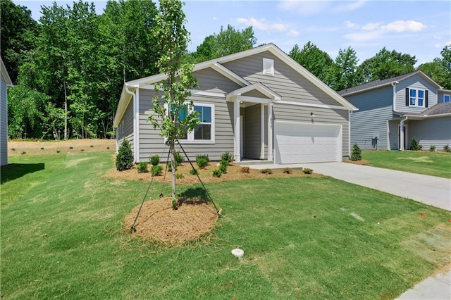 view of front of home with a front lawn and a garage