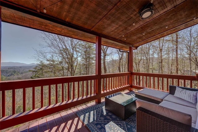 wooden deck with an outdoor hangout area