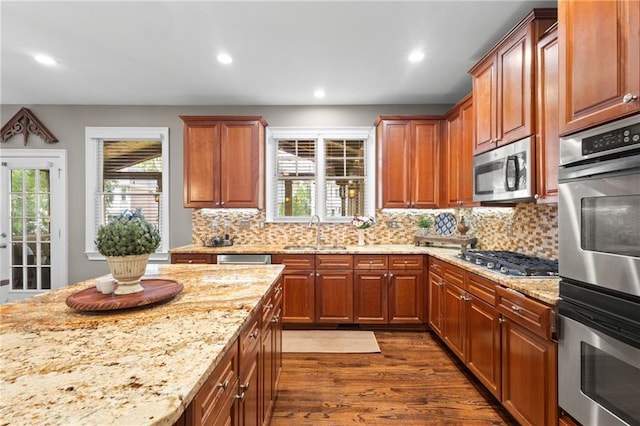 4840 Spring Park Cir, Suwanee, GA 30024 - kitchen featuring stainless steel appliances, dark wood-type flooring, light stone counters, recessed lighting, and decorative backsplash
