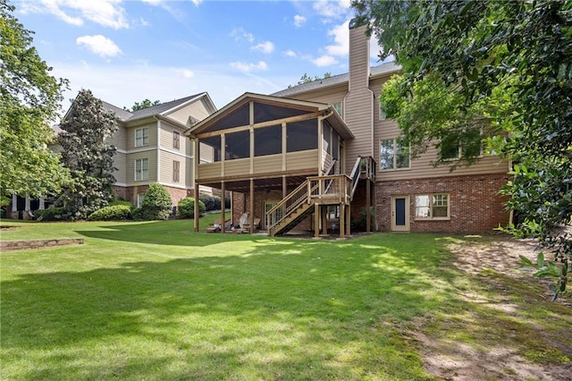 4840 Spring Park Cir, Suwanee, GA 30024 - back of house with a sunroom, brick siding, a chimney, a lawn, and stairway