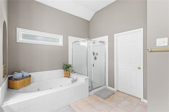 4840 Spring Park Cir, Suwanee, GA 30024 - bathroom featuring a stall shower, a whirlpool tub, lofted ceiling, and tile patterned floors