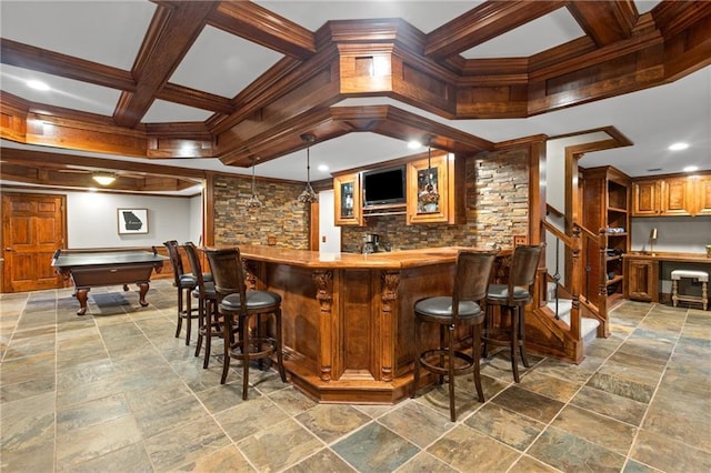 4840 Spring Park Cir, Suwanee, GA 30024 - indoor wet bar featuring coffered ceiling, crown molding, beam ceiling, stone tile floors, and backsplash