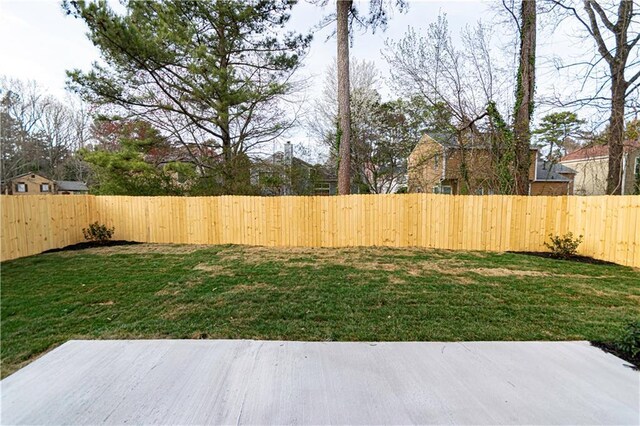view of yard with a fenced backyard