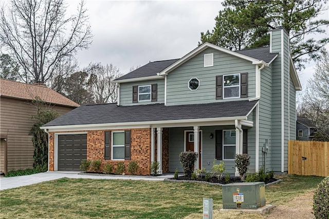 traditional-style home with brick siding, concrete driveway, an attached garage, fence, and a front lawn
