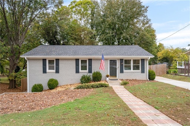 ranch-style home with a front lawn